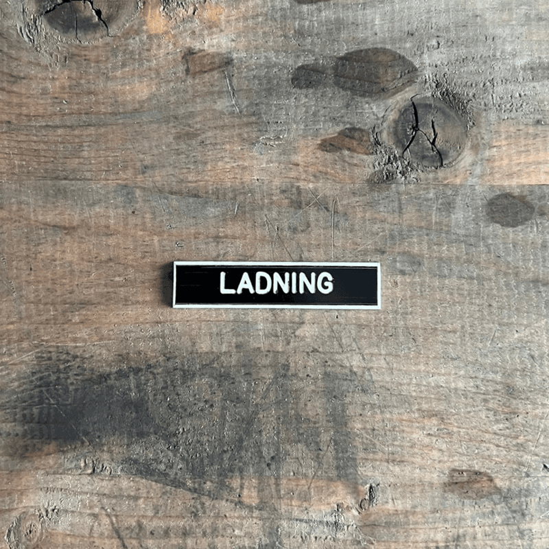 Panelskilt Ladning
